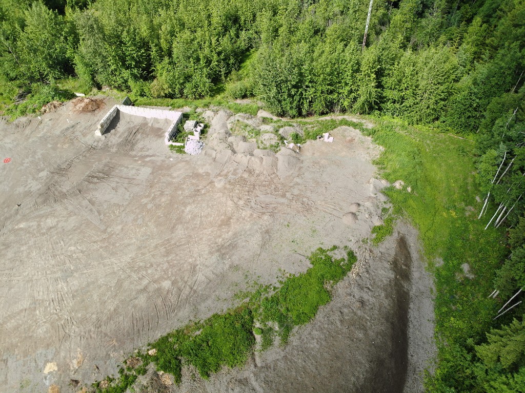 Aerial RGB drone photo of a forest clearing and construction site